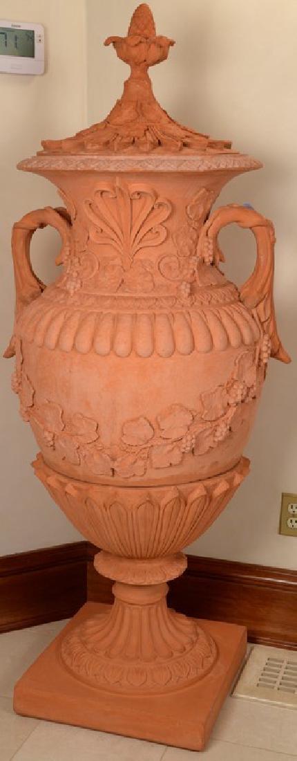 Pair of Terracotta covered urns decorated with (1 of 6)