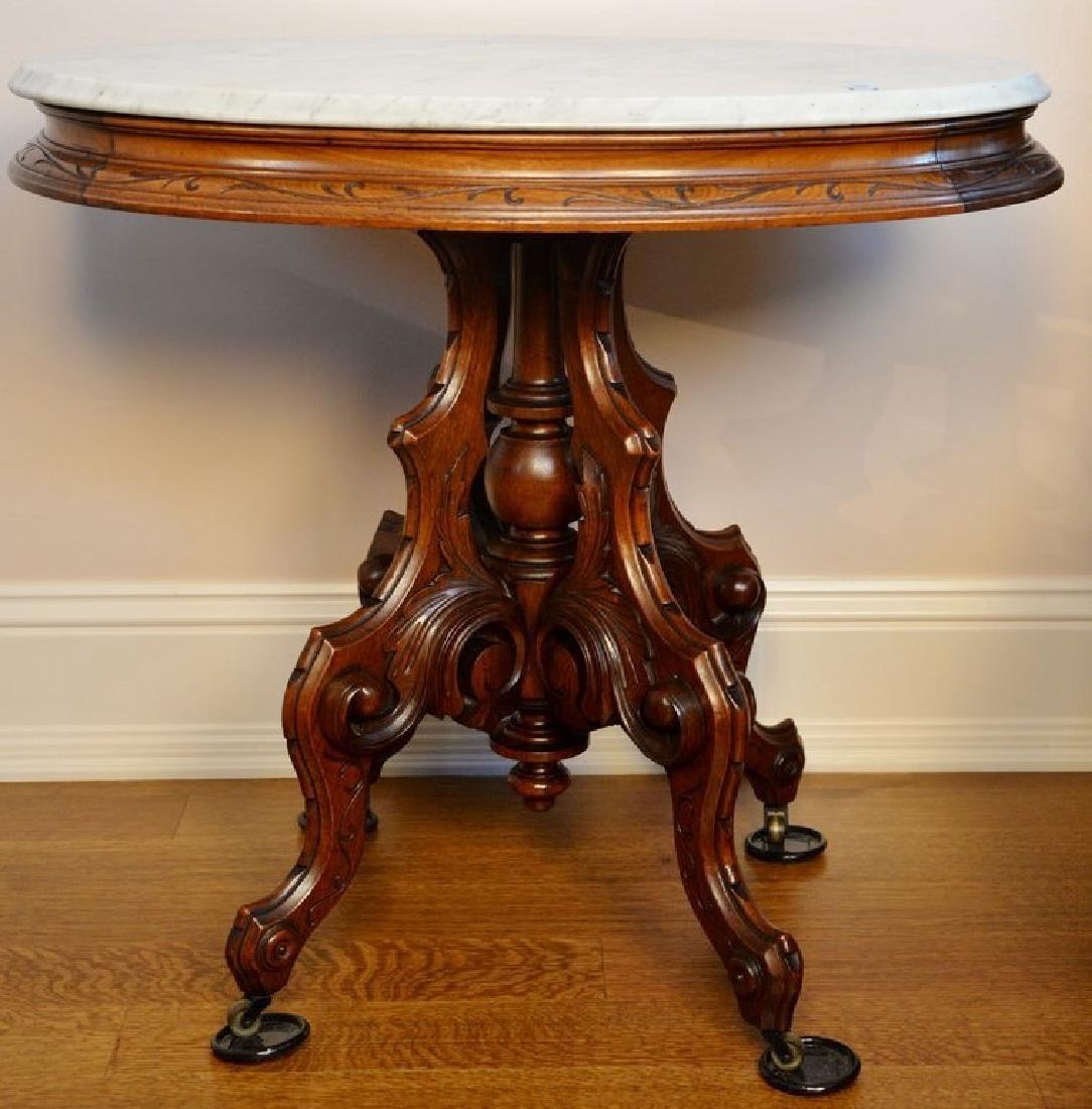Victorian walnut oval marble top table. ht. 29 1/2in., (1 of 4)