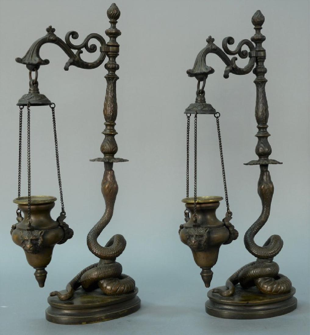 Pair of bronze oil lamps having scrolled arm with (1 of 5)