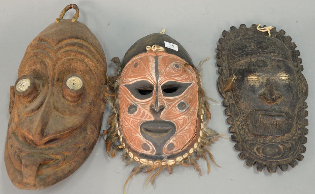 Group of three large wooden African masks. ht. 15in., (1 of 5)