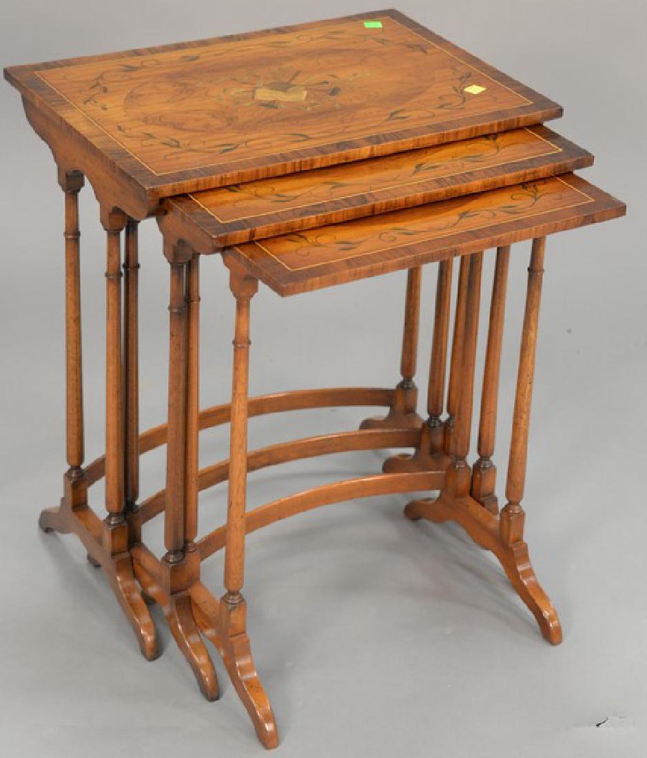 Nest of three paint decorated tables (ht. 22 1/2in., (1 of 3)