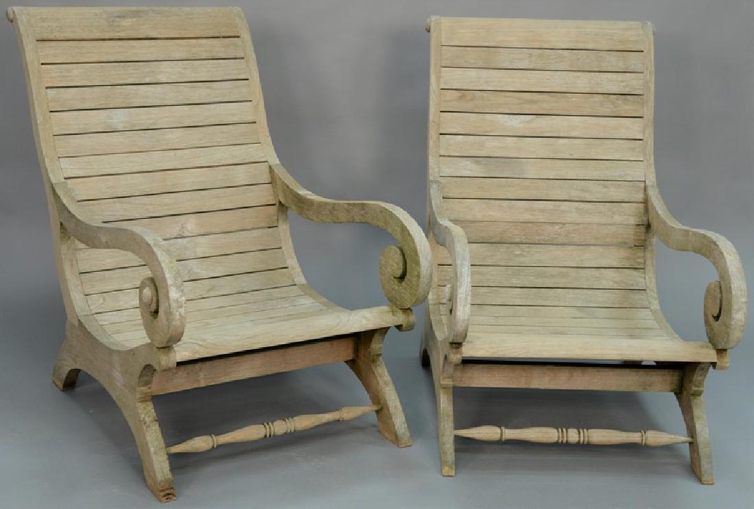 Pair of teak plantation style armchairs.   height to