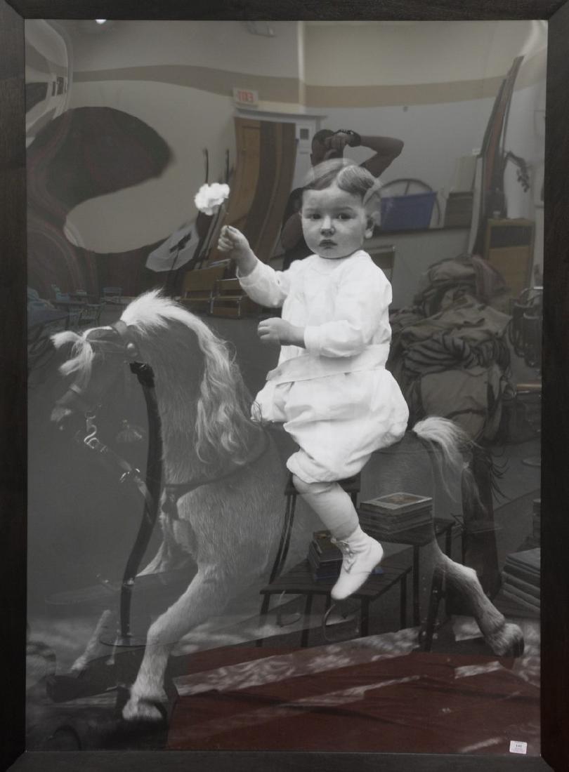 Large framed black and white print of a child on a (1 of 3)