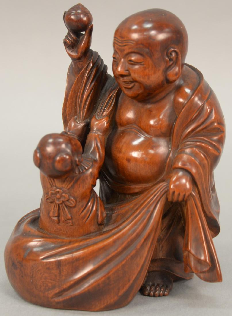 Carved Japanese figure of a Buddha and child, signed on (1 of 3)