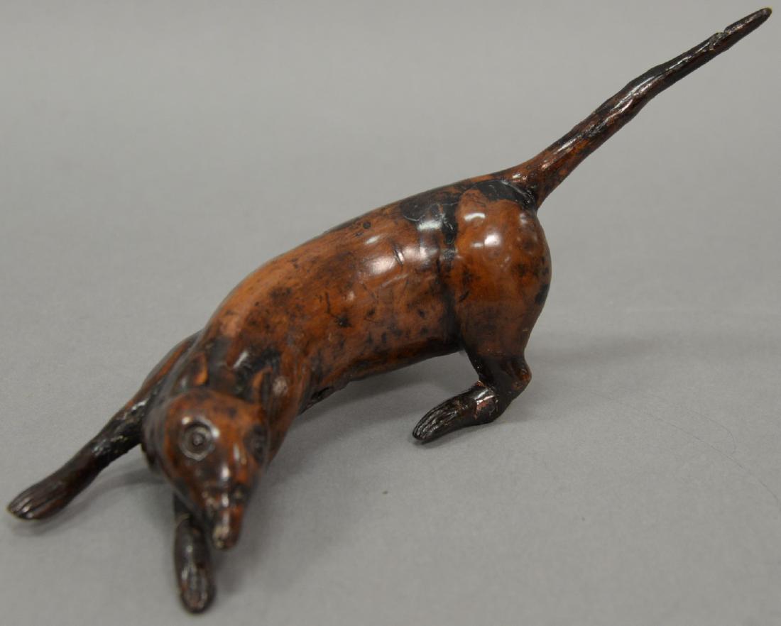 Carved wood root rat (two legs repaired). length 11: Carved wood root rat (two legs repaired). length 11 1/2 inches Provenance: Estate of Peggy & David Rockefeller having stamp/label.