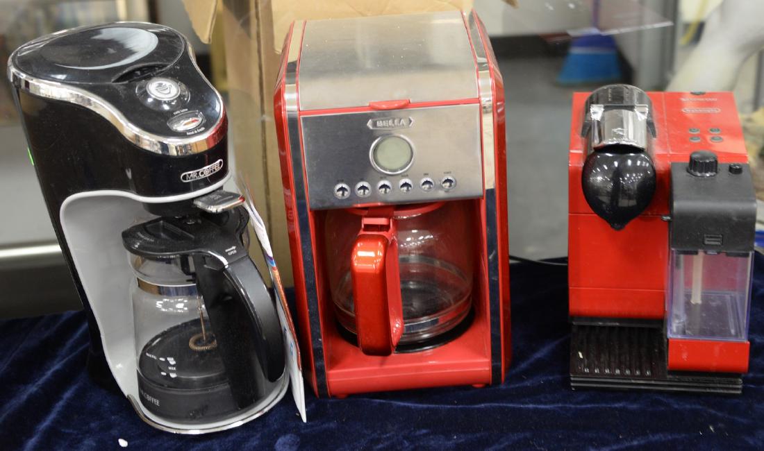 Three coffee makers to include Nespresso Delonghi, in: Three coffee makers to include Nespresso Delonghi, in Bella red, and a Mr. Coffee. Provenance: Estate of Peggy & David Rockefeller having stamp/label.