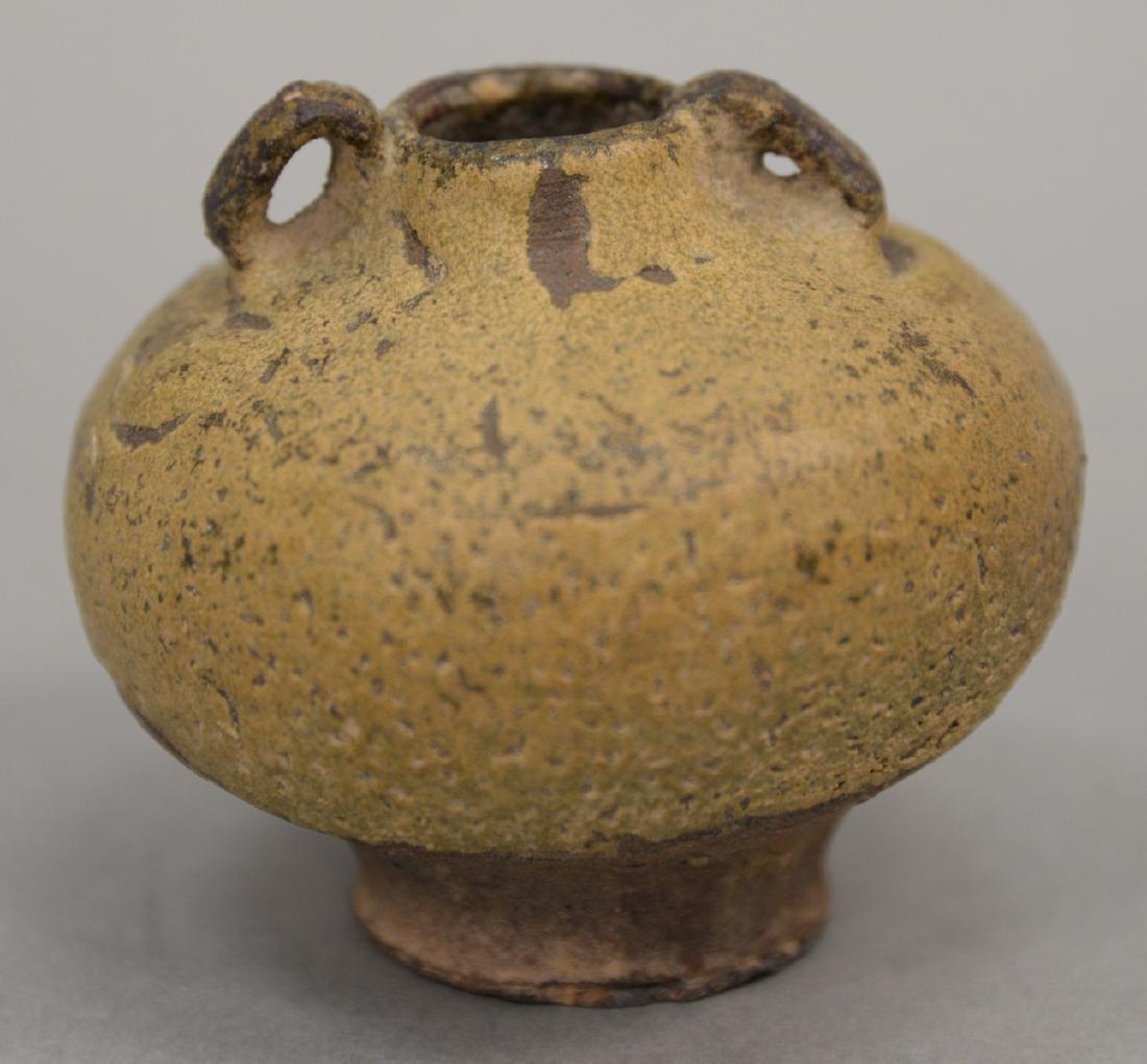 Small grey glazed pottery vessel with two ring handles. (1 of 4)