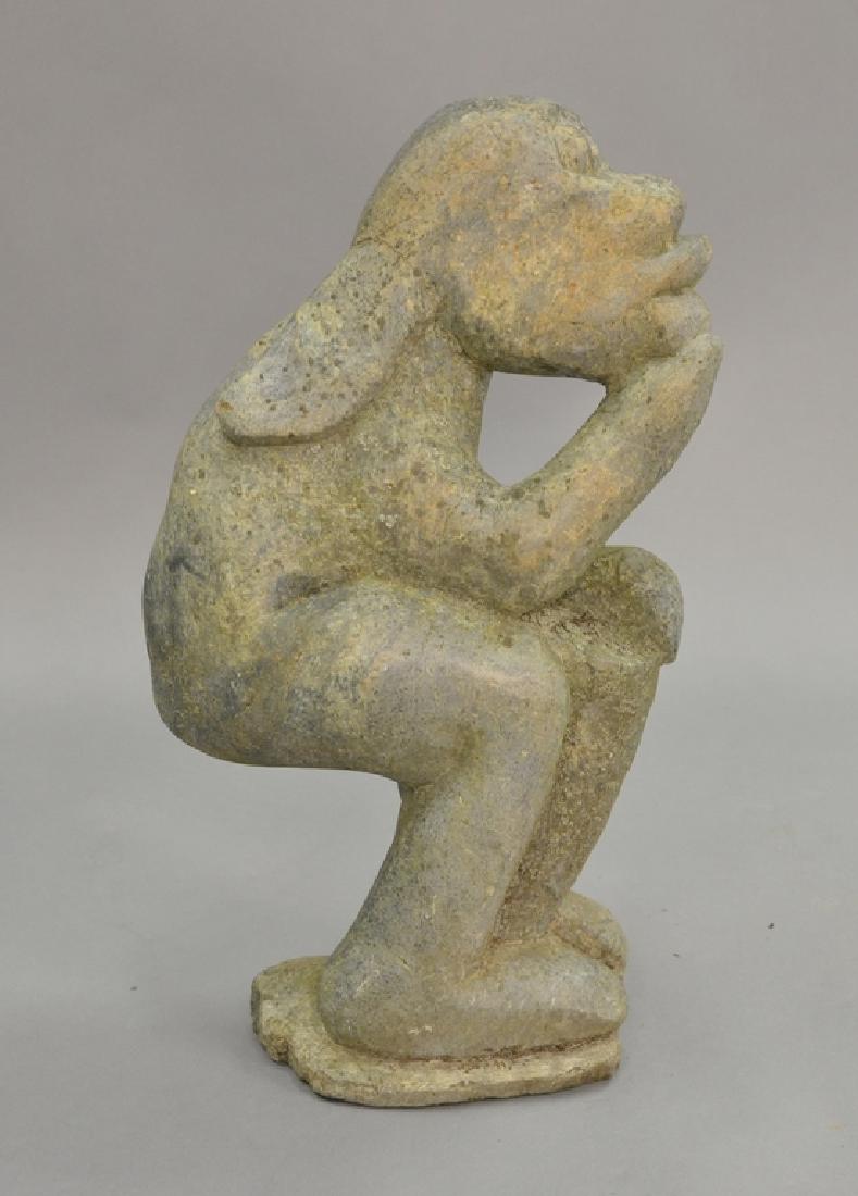 Carved stone figure with long ears playing bongo, (1 of 7)