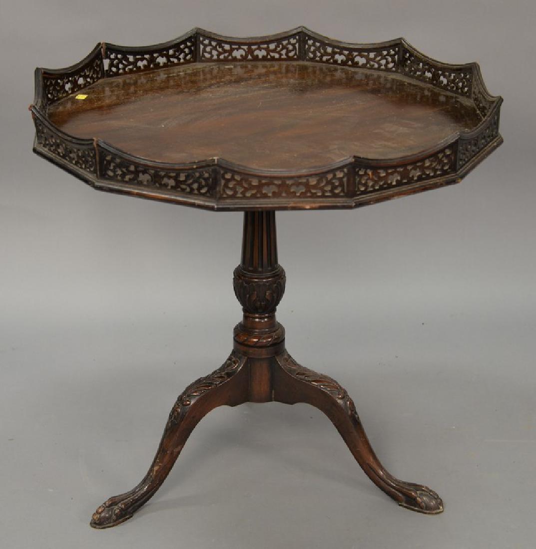 Mahogany tilt top tea table with pierced gallery top.: Mahogany tilt top tea table with pierced gallery top. ht. 29in., dia. 31in.