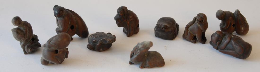 Group of ten carved wood netsukes animal figures to (1 of 4)