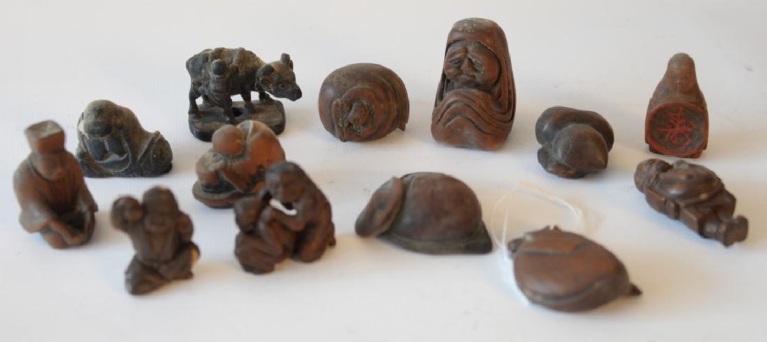 Group of thirteen carved netsukes including carved horn (1 of 4)