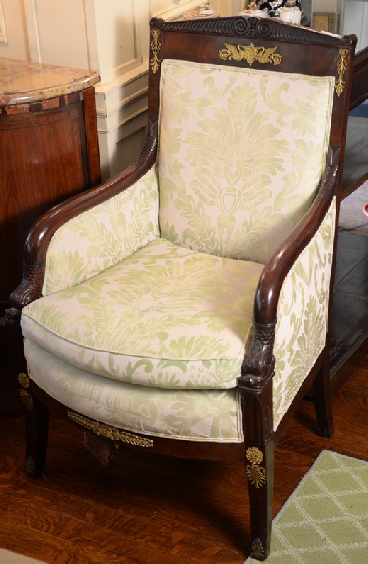 Pair of French Empire bergeres with gilt bronze mounts: Pair of French Empire bergeres with gilt bronze mounts and dolphin supports. height 38 inches, width 28 inches, depth 23 1/2 inches ***If this lot is not picked up on Sat. 9/22, Sun. 9/23, or Tues 9/2