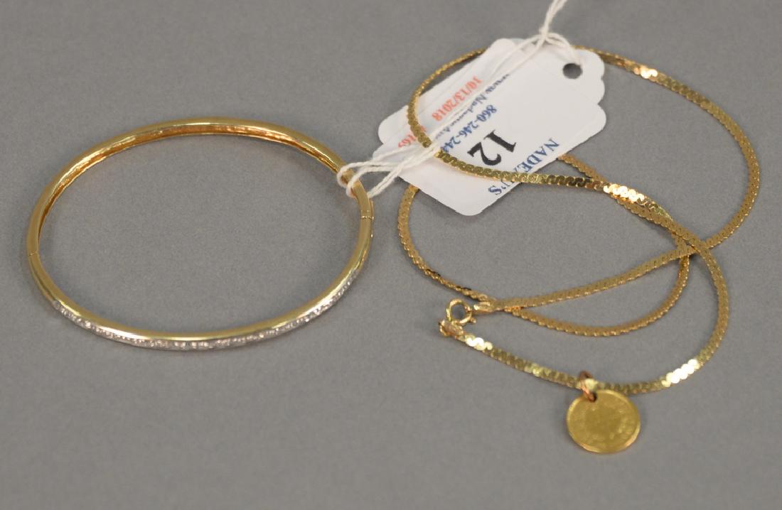 Two piece lot to include a 14 karat gold chain with (1 of 3)