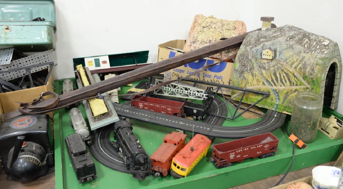 Lionel train and accessories including tunnels, bridge,: Lionel train and accessories including tunnels, bridge, lights, transformers, switches, and trucks plus HO track.