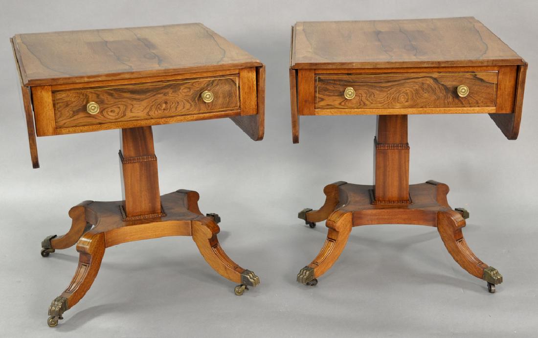 Pair of Duncan Phyfe style rosewood end tables having: Pair of Duncan Phyfe style rosewood end tables having brass inlaid tops, with drop leaves over one drawer set on quadrant base with brass capped feet, height 26.5 inches.