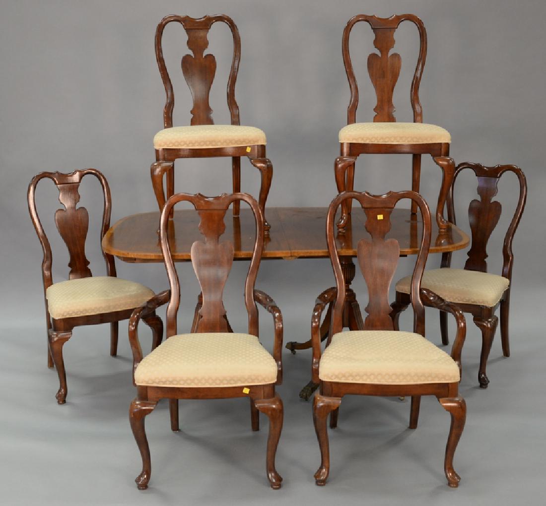 Seven piece lot to include a mahogany double pedestal: Seven piece lot to include a mahogany double pedestal dining table with banded inlaid top plus four 13 1/2 inch leaves. ht. 30 in., top: 45" x 64" and a set of six Queen Anne dining chairs with two ar