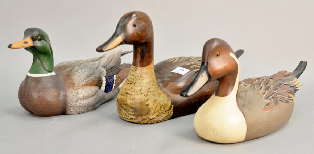 Three carved wood decoys including two Tom Taber duck: Three carved wood decoys including two Tom Taber duck decoy Duck Unlimited (lg. 20 in. & 23 in.), and Valhalla decoy (lg. 16 in.).
