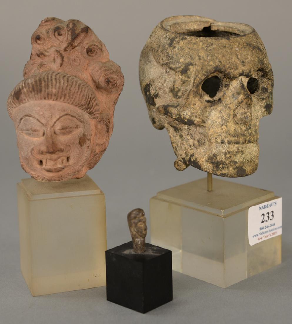 Three early sculptures of busts, iron skulls, stone (1 of 5)