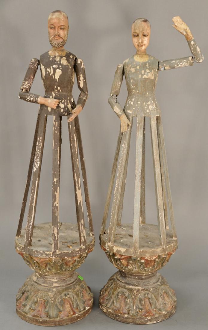 Pair of carved and polychrome cage dolls,  having (1 of 8)