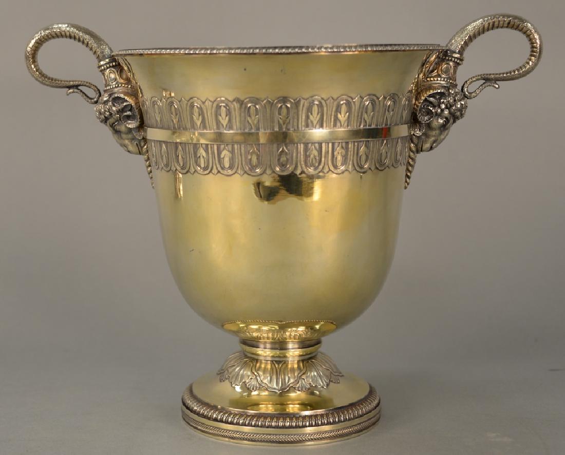 Benjamin Smith silver gilt wine cooler having snake: Benjamin Smith silver gilt wine cooler having snake style handles with large ram heads and band surround over oval chased leaves on round gadrooned and dart base, Shrewsbury 1813 in body, foot marked 