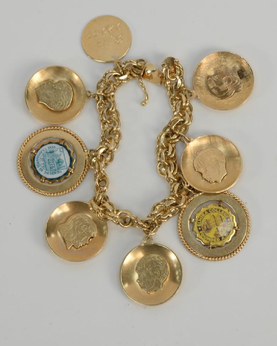 14 karat gold charm bracelet with 14 karat gold charms. (1 of 5)