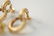 Two pairs of 14 karat gold ear clips to include a - 4