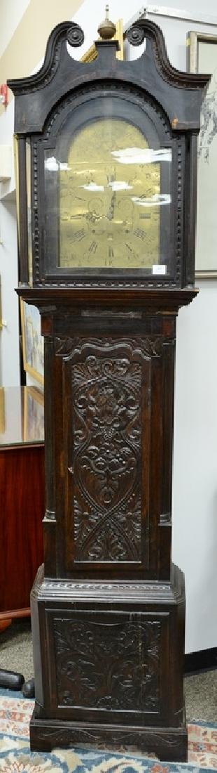 English oak tall clock with carved door and base, (1 of 6)