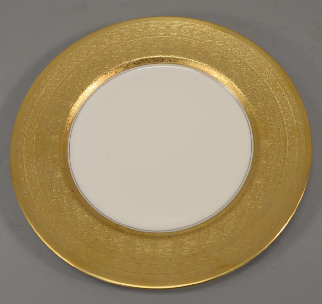 Set of twelve Pickard dinner plates having gold rim