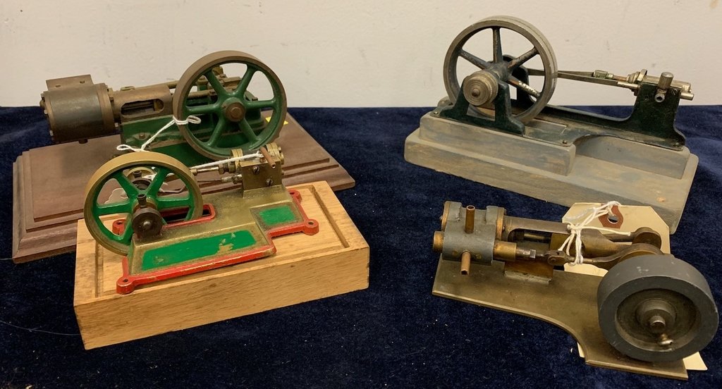 Five small horizontal steam engines, bronze base, brass: Five small horizontal steam engines, bronze base, brass flywheel on wood base, 2 1/4" flywheel, lg. 6", wd. 3 1/4", ht. 4"; horizontal steam engine, green painted cast iron frame, aluminum on wood bas