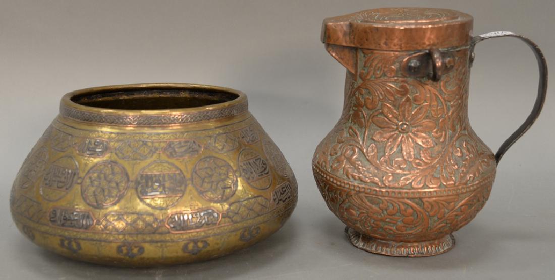Two piece lot to include multi metal Middle Eastern: Two piece lot to include multi metal Middle Eastern hand spun bowl (19th century or later) and brass repousse pitcher (missing finiol).