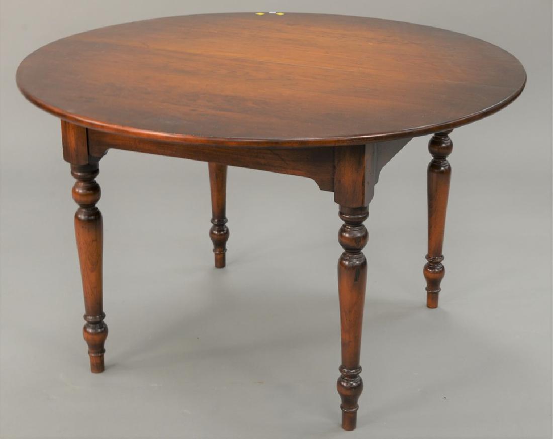 D.R. Dimes lot to include a set of three Windsor style: D.R. Dimes lot to include a set of three Windsor style chairs and a round table on turned legs with two 12 in. leaves, total size open 72 in., ht. 30 in., dia. 48 in.
