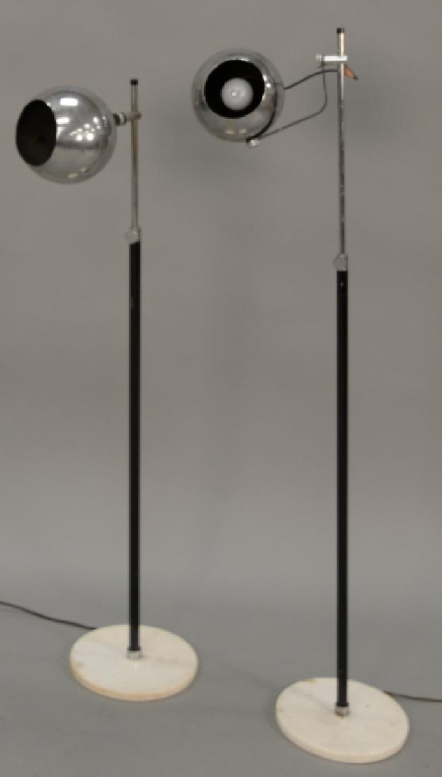 Pair of Italian modern floor lamps with chrome globular: Pair of Italian modern floor lamps with chrome globular shade on marble bases (ht. 48 in.). Provenance: Estate of Kenneth Jay Lane