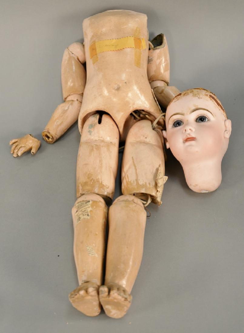 Jumeau bisque head doll with composition jointed body: Jumeau bisque head doll with composition jointed body (one hand off). ht. 32 inches