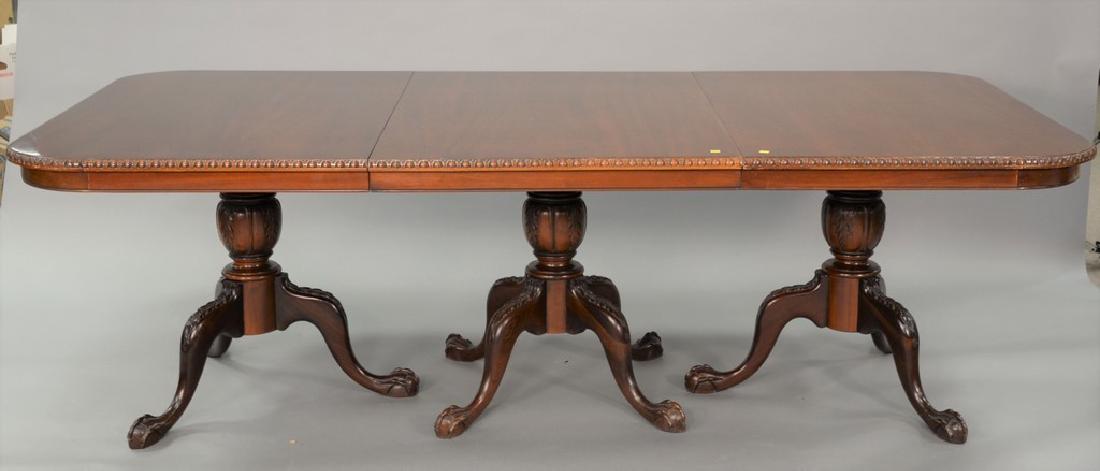 Mahogany triple pedestal dining table with ball and: Mahogany triple pedestal dining table with ball and claw feet plus two extra 20 inch leaves. ht. 30 in., top closed: 48" x 96", top open: 48" x 136" Provenance: Estate of Stephen M. Serlin of Lake Geo