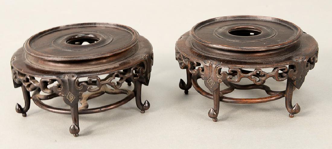 Pair of teakwood footed bases/stands, China: Pair of teakwood footed bases/stands, China probably 19th century. dia. 3 1/2 in. & 3 in. Provenance: Estate of Kenneth Jay Lane