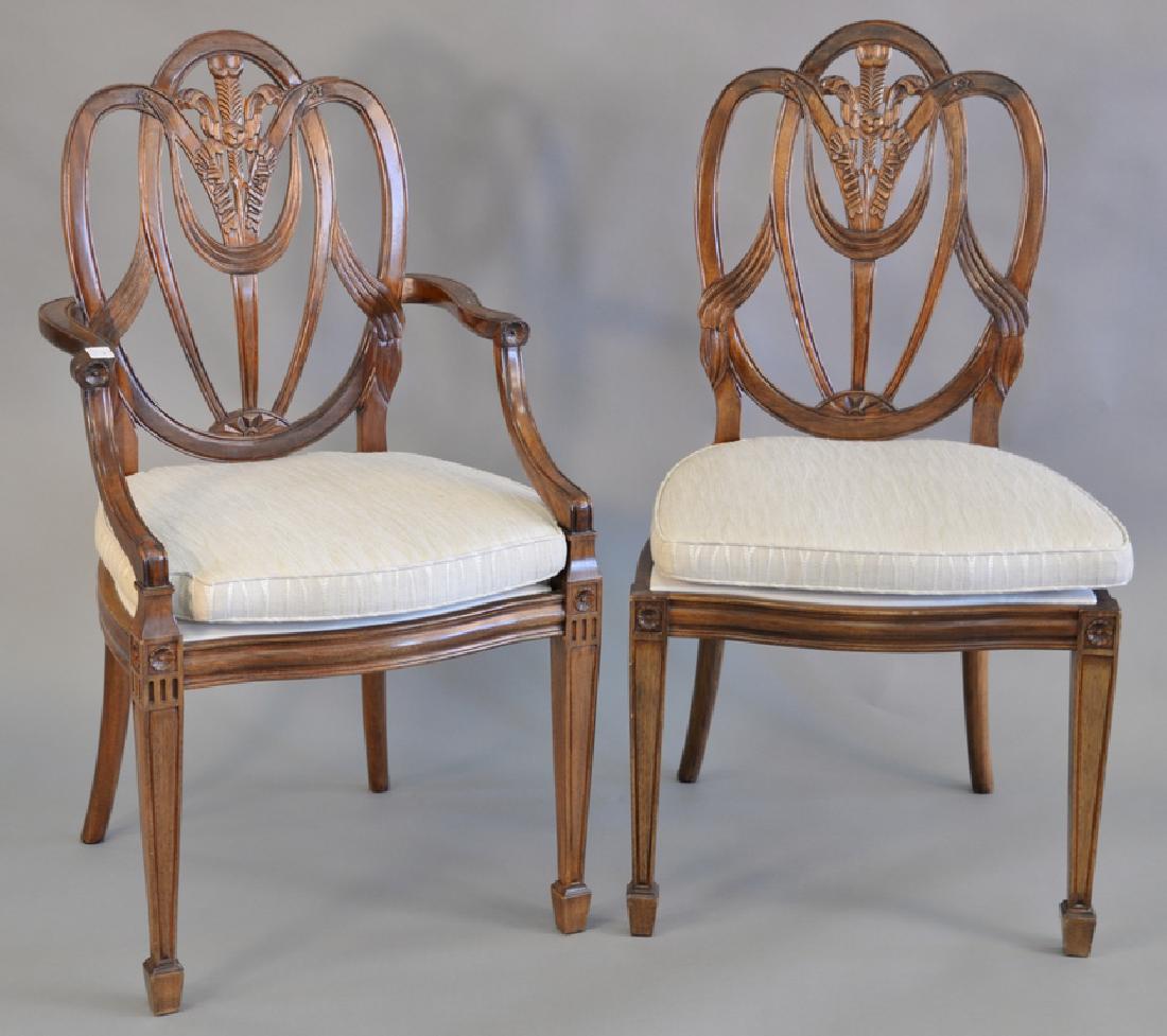 Set of twelve Federal mahogany style dining chairs with: Set of twelve Federal mahogany style dining chairs with plaque marked Paramount Antiques N.Y. includes two armchairs and ten side chairs.