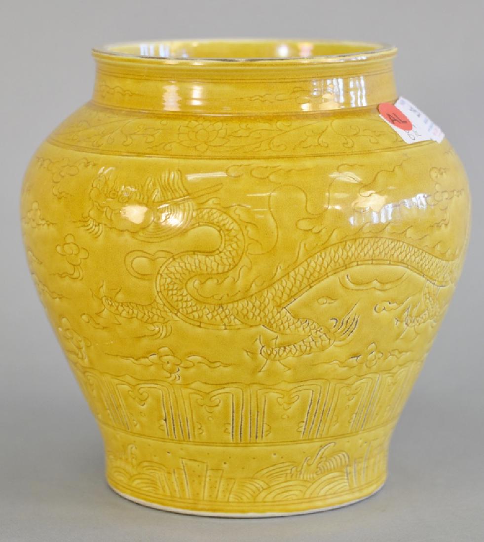 Yellow glazed five claw dragon vase having incised: Yellow glazed five claw dragon vase having incised flying dragon with flaming clouds underglaze blue six character marks on bottom (as is). height 8 1/2 in.