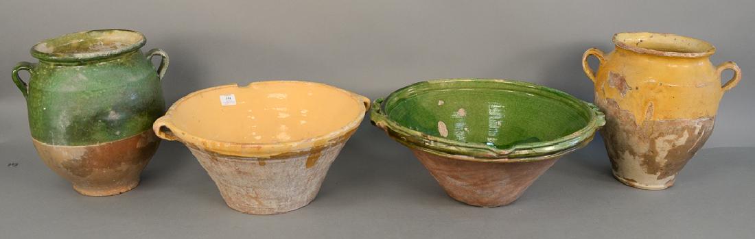Group of four French earthenware pieces, two large: Group of four French earthenware pieces, two large bowls and two large confit pots or jars in green and yellow glaze, ht. 10 in. to 14 1/2 in.