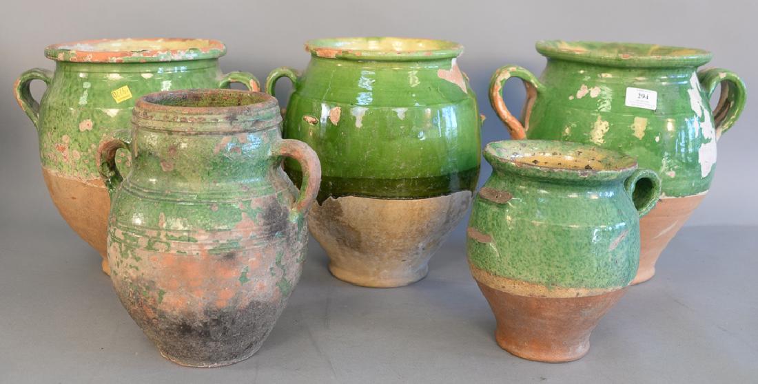 Group of five French earthenware glazed jars confit: Group of five French earthenware glazed jars confit pots with handles in green glaze, ht. 8 1/2 in. to 13 in.