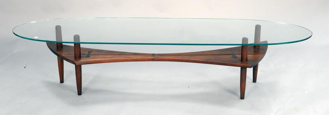 Rosewood coffee table attributed to Richard Kagan: Rosewood coffee table attributed to Richard Kagan having bowtie joinery with sculpted bowtie walnut boards and racetrack glass top. ht. 16 in., top: 18" x 72".