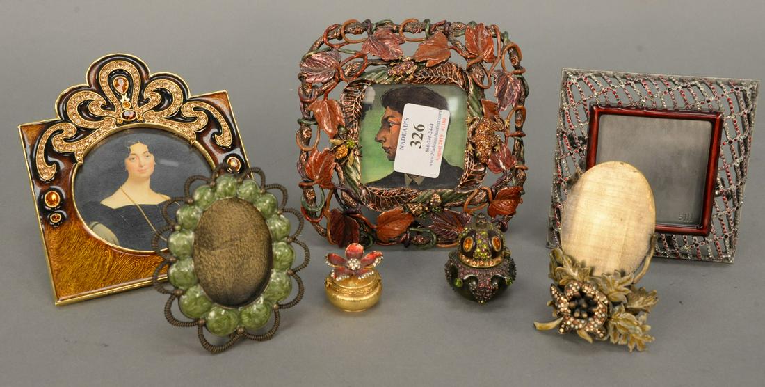 Jay Strongwater eight piece enameled group to include: Jay Strongwater eight piece enameled group to include enameled and jeweled frog and bug frame, enameled picture frame, three small picture frames, and two small pill boxes, all marked Jay Strongwater.