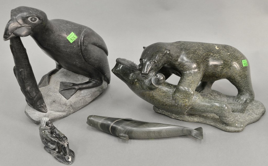 Four eskimo carvings to include large polar bear: Four eskimo carvings to include large polar bear attacking a man, large bird with fish, and two small figures. tallest ht. 12 in.