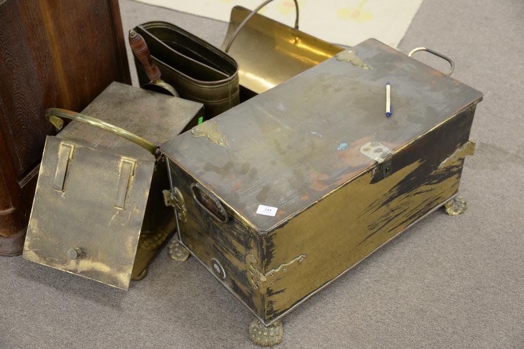 Four piece brass lot to include rectangular hinged: Four piece brass lot to include rectangular hinged covered box on paw fee, coal hod and log holder and a holder with lion head handles. ht. 14 in., top: 14" x 27".