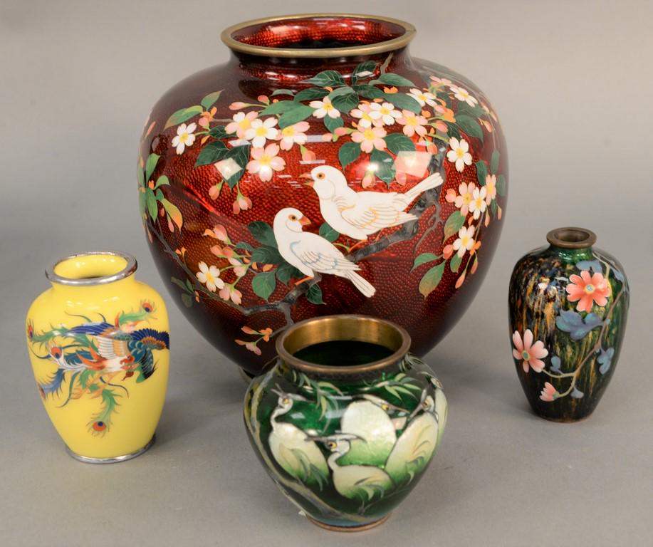 Group of four cloisonne enamel vases, Japan, 19th/20th: Group of four cloisonne enamel vases, Japan, 19th/20th century Meiji/Taisho, including: one with a red foil ground with white flowers; one with yellow ground decorated with phoenix, silver rim; one wi