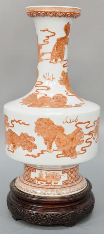 Chinese porcelain vase, having underglazed iron red: Chinese porcelain vase, having underglazed iron red painted Buddhist lion, 19th century, with Kangxi mark on bottom. height of vase 15 1/2 inches.