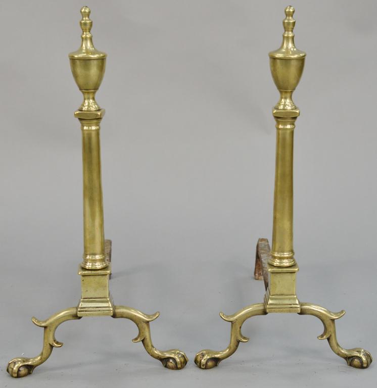 Pair of Chippendale brass andirons, with urn tops and: Pair of Chippendale brass andirons, with urn tops and turned shafts, set on ball and claw feet. height 25 3/8 inches.