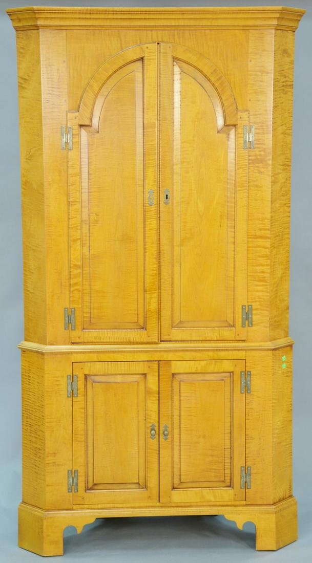 Eldred Wheeler tiger maple two part corner cupboard: Eldred Wheeler tiger maple two part corner cupboard with two doors over twoo doors on bracket base. ht. 82 in., wd. 42 in.