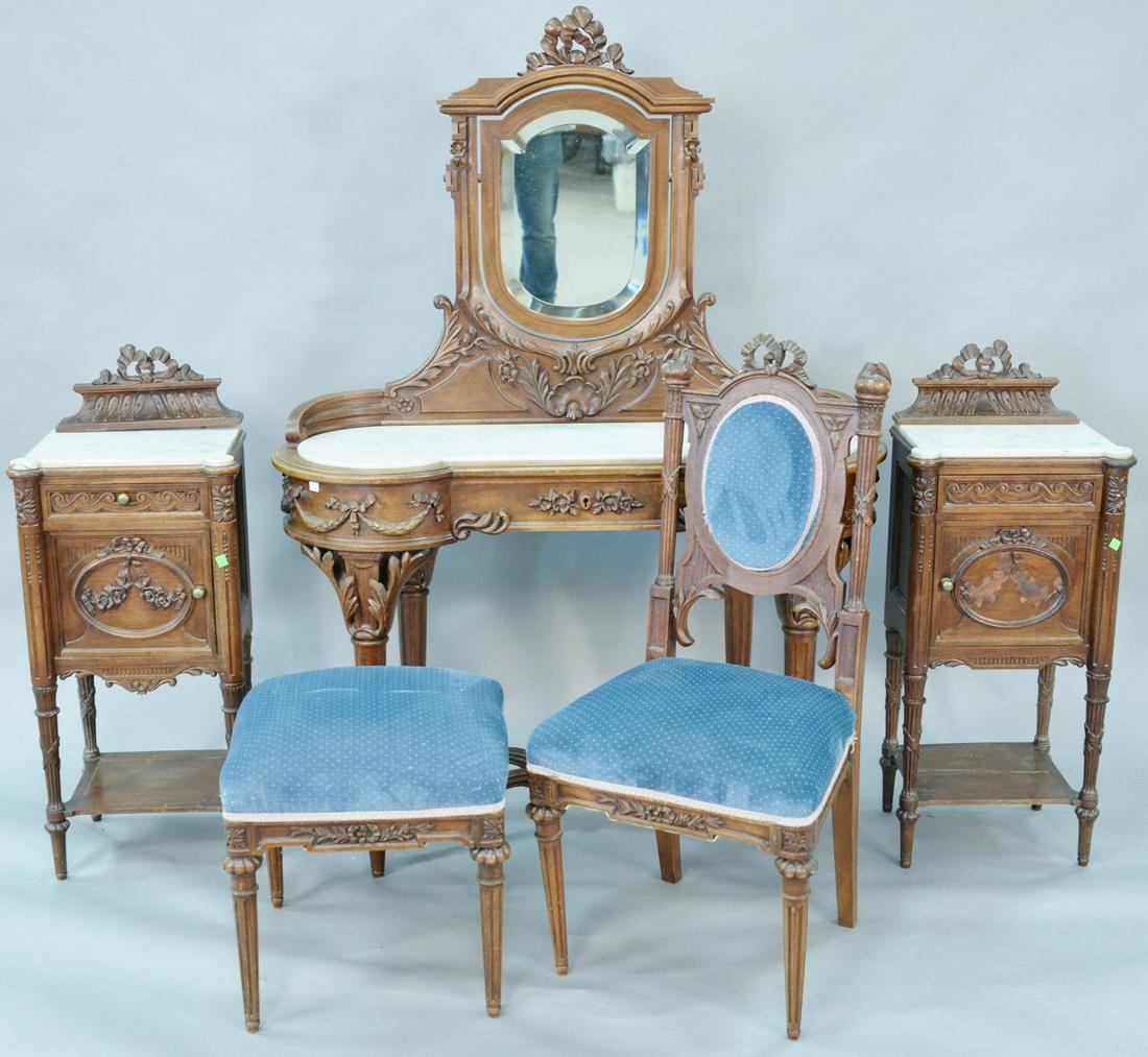 Five piece Louis XXI style walnut vanity and mirror: Five piece Louis XXI style walnut vanity and mirror with inset marble top with chair and bench. along with pair walnut marble top stands with one door and one drawer each, (carving on one door missing