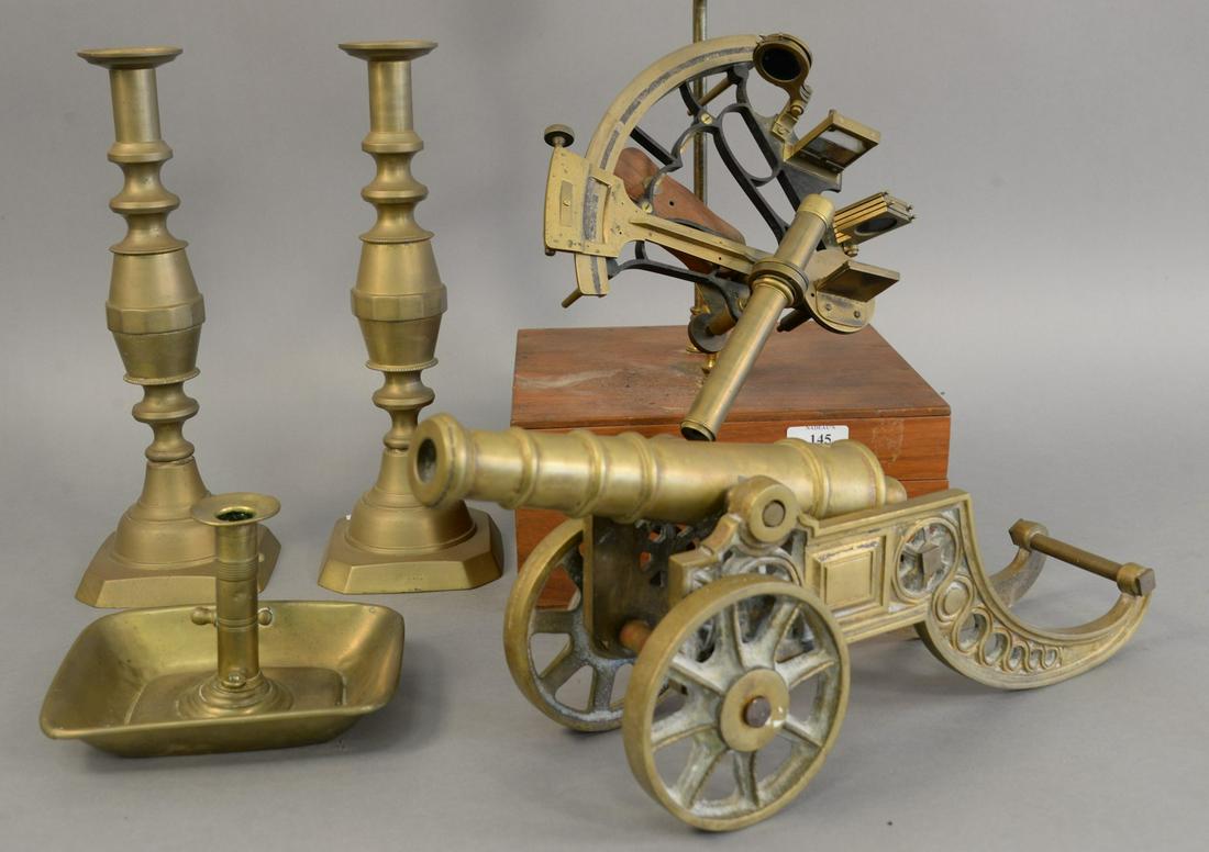 Group of brass to include bell pattern Mark III sextant: Group of brass to include bell pattern Mark III sextant with original box, brass canon, and three candlesticks. Provenance: Estate from Sutton Place, N.Y. name withheld by request
