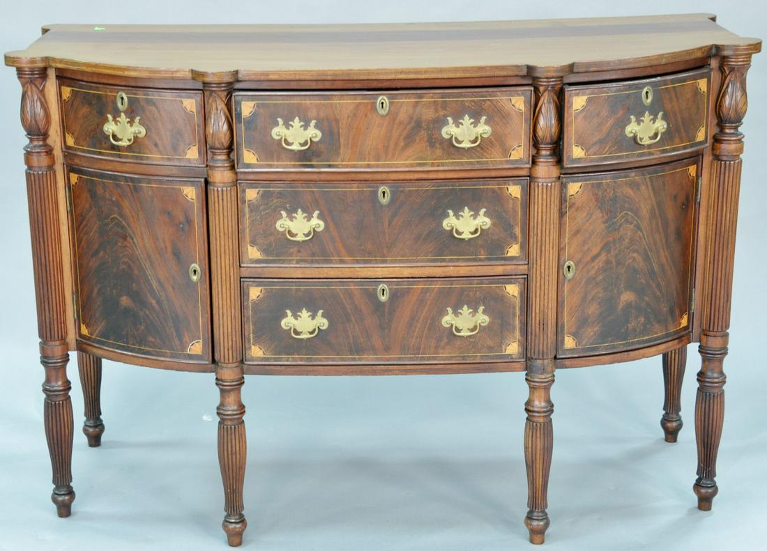 Sheraton style mahogany sideboard with fan inlays on: Sheraton style mahogany sideboard with fan inlays on turned and reeded legs (made up of old elements). ht. 40 in., wd. 60 in.